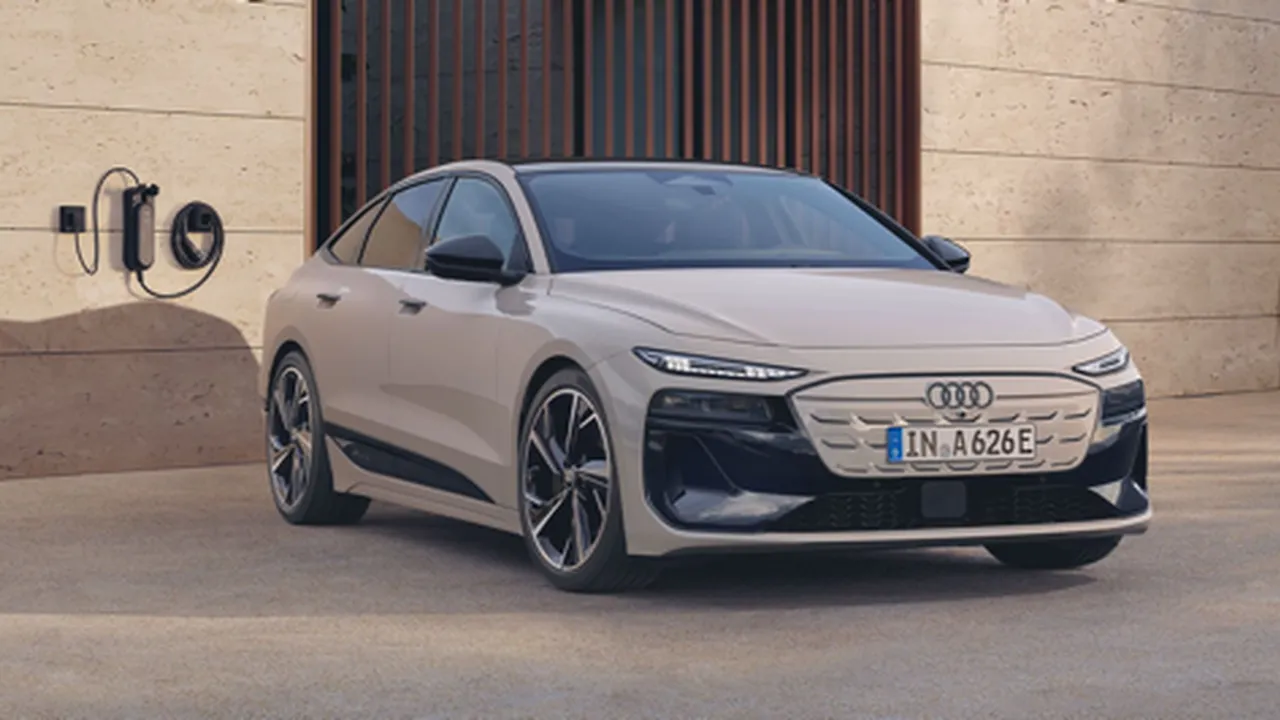 Audi A6 e-tron cargando en una estación doméstica moderna.